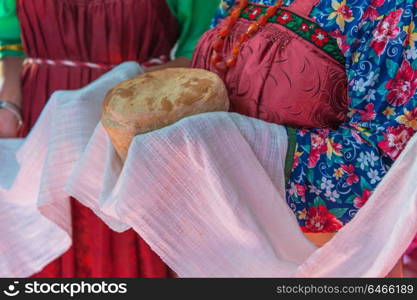 Russian old-fashioned wedding. Russian old-fashioned wedding. Hands with bread, meeting with guests