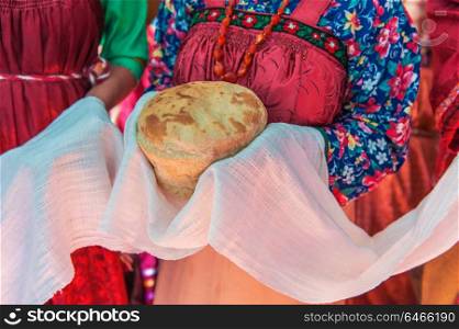 Russian old-fashioned wedding. Russian old-fashioned wedding. Hands with bread, meeting with guests