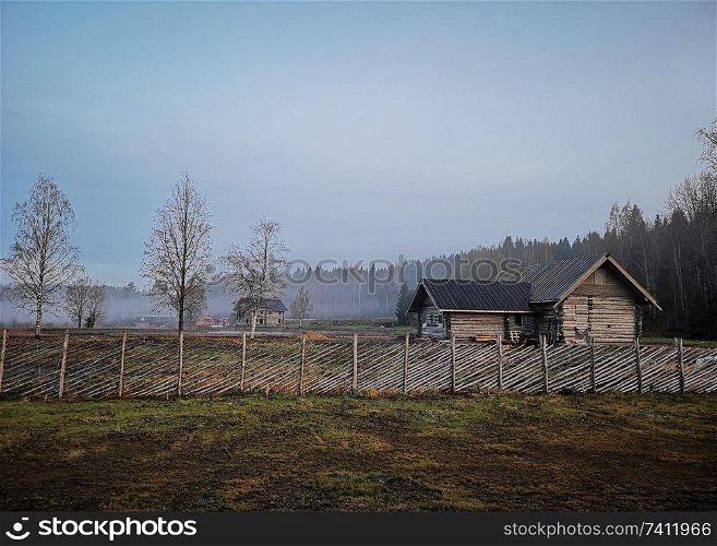 Russian old village on the edge of the forest. North-West Russia, Wooden architecture of Karelians and Veps.. Russian old village