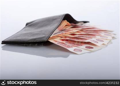 Russian rouble banknotes in black leather wallet