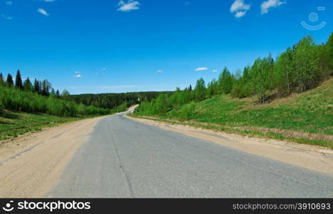 Russian rural landscape with road Distance in Forest.Arkhangelsk region of Russia