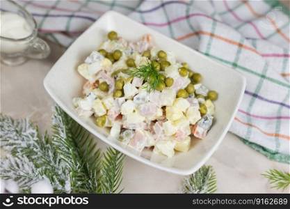Russian salad festive Olivier with vegetables and sausage