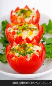 Russian salad served in tomatoes