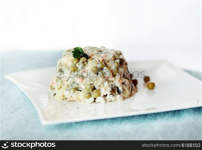 Russian salad with peas.