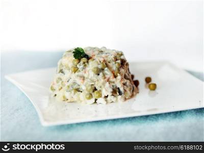 Russian salad with peas.