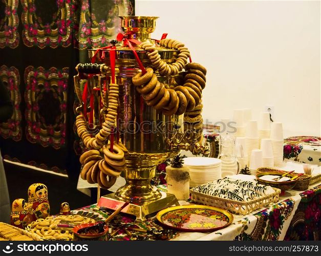 Russian samovar with steering-wheel, tea and russian traditional paraphernalia