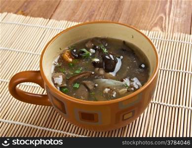 Russian sauerkraut soup with mushrooms and pearl barley