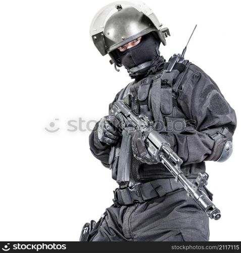 Russian special forces operator in black uniform and bulletproof helmet. Russian special forces