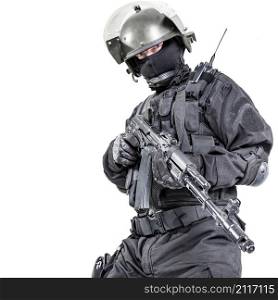 Russian special forces operator in black uniform and bulletproof helmet. Russian special forces