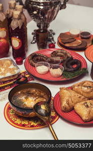 Russian table with food. Table with traditional russian food decorated in russian style