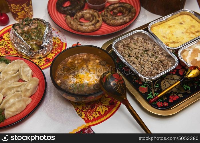 Russian table with food. Table with traditional russian food decorated in russian style