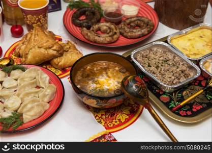 Russian table with food. Table with traditional russian food decorated in russian style