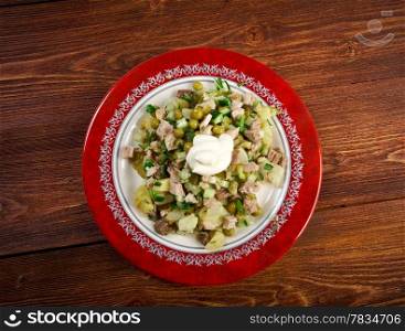 Russian traditional salad olivier with pea
