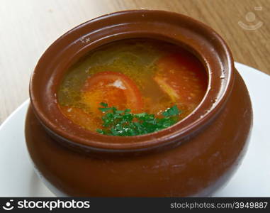 Russian vegetable soup in ceramic pot.