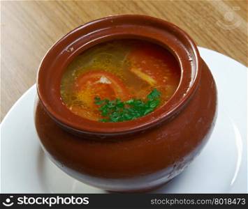 Russian vegetable soup in ceramic pot.