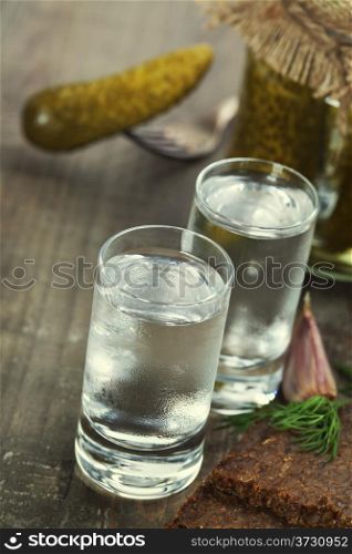 Russian vodka with traditional black bread and pickles