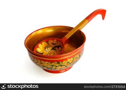 Russian wooden painted bowl with ladle isolated