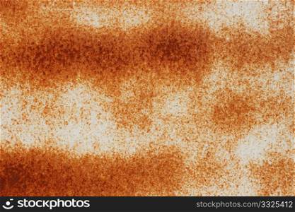 Rust is shown through a layers of paint on the metal flat surface