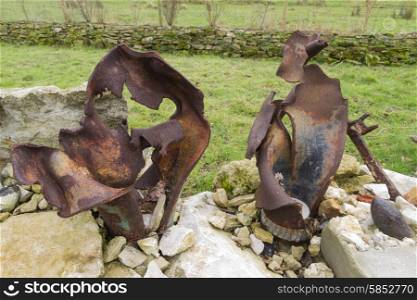Rusted exploded UK artillery shells, fired from tank.