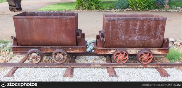 Rusted old mining carriages filled with stones, Namibia