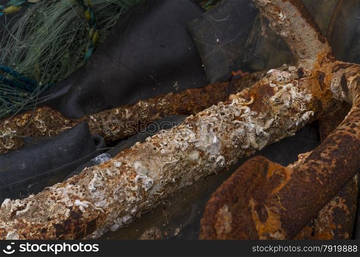 Rusted or corroded metal bar, by sea so much salt corrosion.
