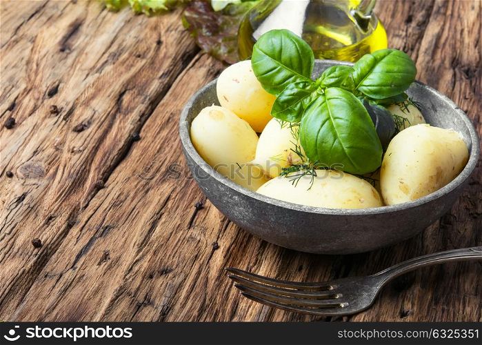rustic boiled potatoes. rustic potatoes boiled with a bunch of fresh basil.Russian food