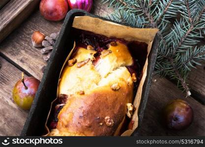 Rustic cake for Christmas. Christmas plum cake in a rustic style. Christmas decorations and food