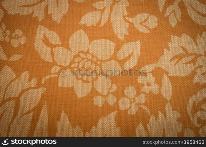 Rustic canvas fabric texture in orange color.