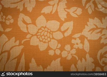Rustic canvas fabric texture in orange color.