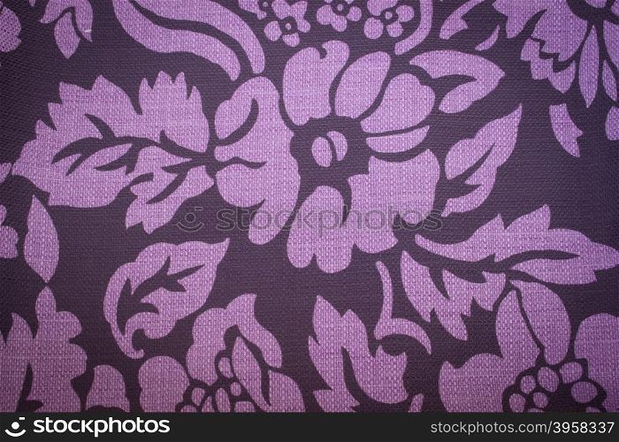 Rustic canvas fabric texture in purple color.