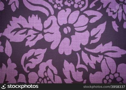 Rustic canvas fabric texture in purple color.