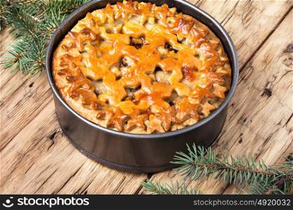 rustic Christmas home pie. traditional christmas homemade cake on a retro background