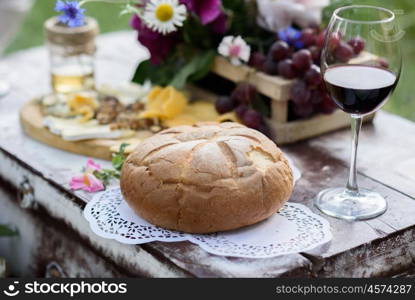 rustic decorative photo zone with suitcases, wine. cheese