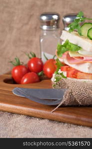 Rustic kitchen setting for fresh club sandwich