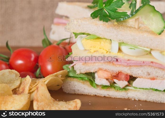Rustic kitchen setting for fresh club sandwich