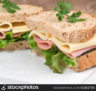 Rustic kitchen setting for fresh ham and cheese sandwich