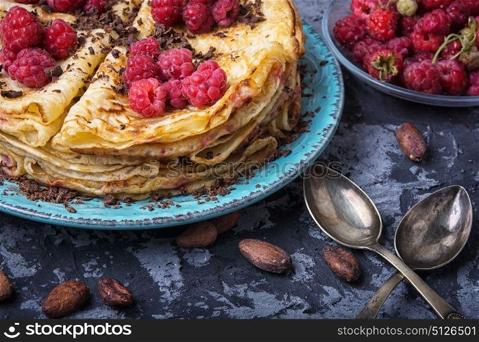 rustic pancakes with berries. Pancakes with fresh raspberries and cocoa beans
