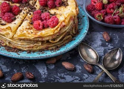 rustic pancakes with berries. Pancakes with fresh raspberries and cocoa beans