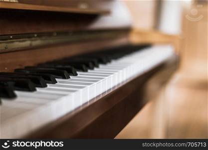 Rustic piano keys, close up picture. Classical instrument.