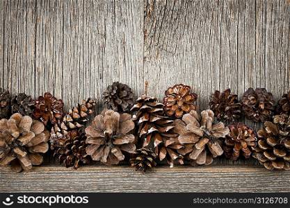 Rustic wood with pine cones