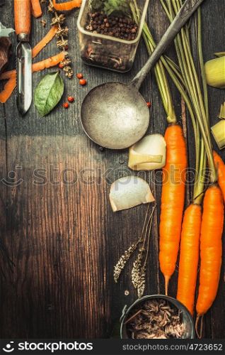 Rustic wooden food background with cooking spoon , vegetables and ingredients, top view, place for text