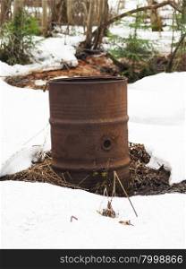 rusty barrel in the snow