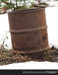 rusty barrel in the snow