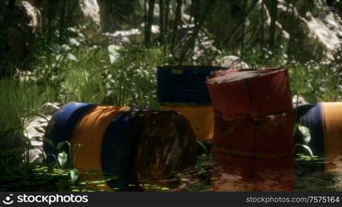 Rusty barrels in green forest illustrates the pollution of environment by oil spills. Rusty barrels in green forest