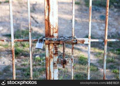 Rusty door with chain and padlock closed