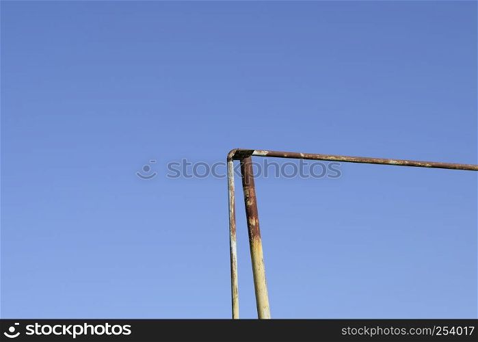 Rusty gas pipe against the blue sky.. Rusty gas pipe against the blue sky
