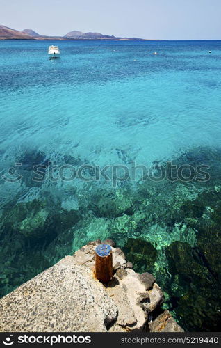 rusty metal yacht spain harbor pier boat in the blue sky arrecife teguise lanzarote