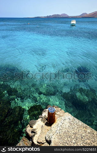 rusty metal yacht spain harbor pier boat in the blue sky arrecife teguise lanzarote