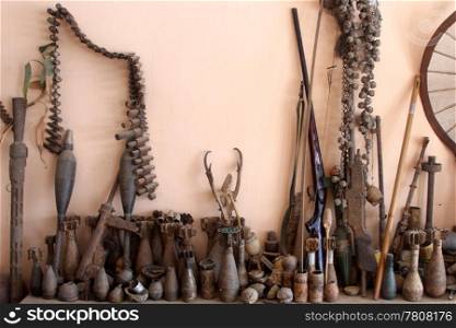 Rusty old weapons in the room, Phonsavan, Laos