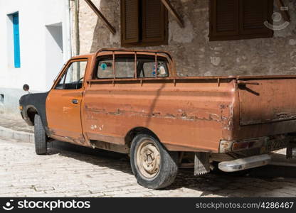 Rusty pick up truck, battered old automobile.